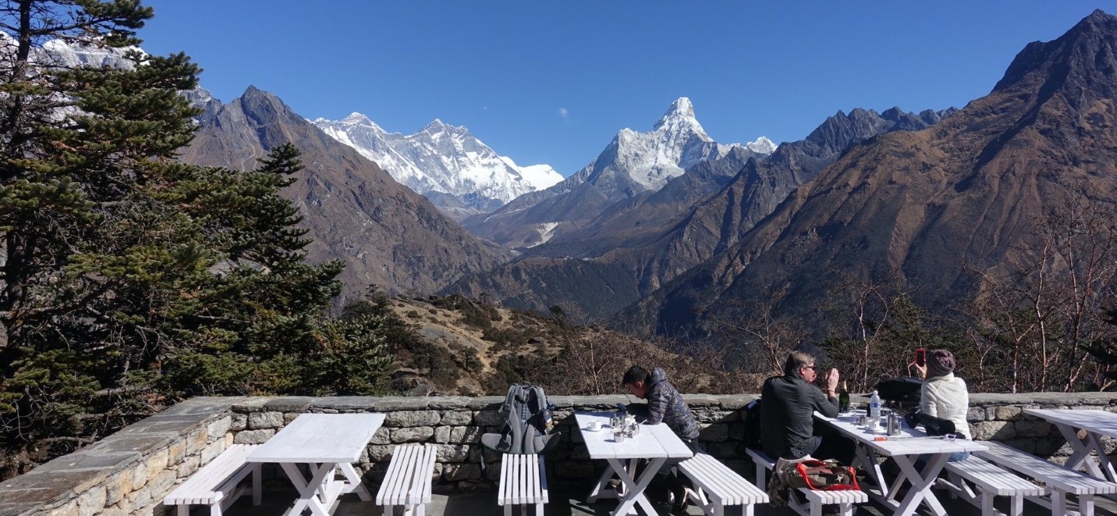 Outdoor restaurant terrace of Everest View Hotel overlooking the Himalayas, with panoramic views of Mount Everest and surrounding peaks in the Khumbu region.