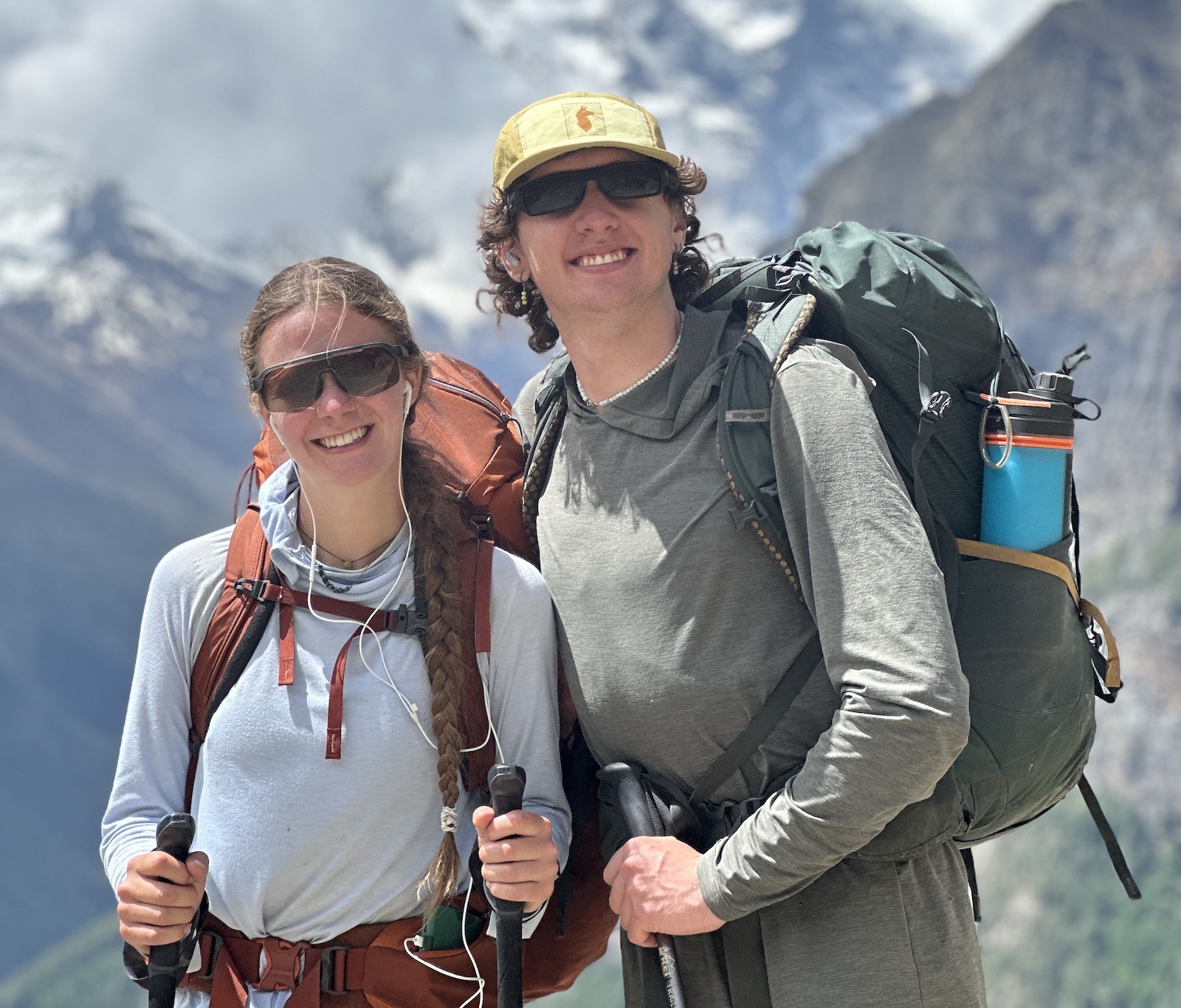 Trekker wearing lightweight hiking clothes while walking the Mardi Himal ridge with Himalayan mountain views in Nepal.
