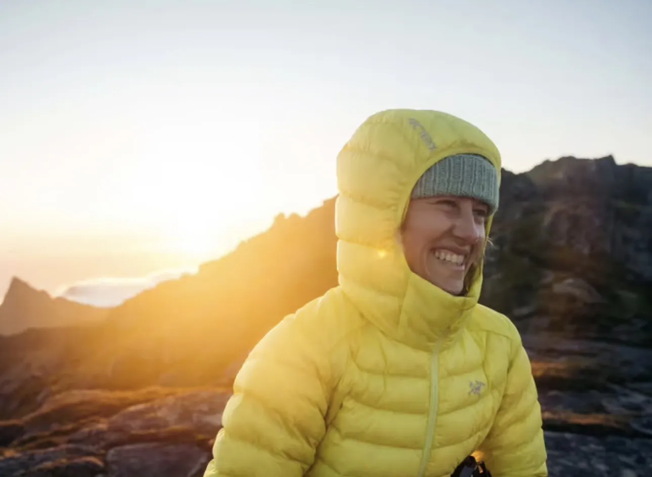 Trekker wearing a warm down jacket inside a High Camp teahouse on the Mardi Himal Trek in Nepal.