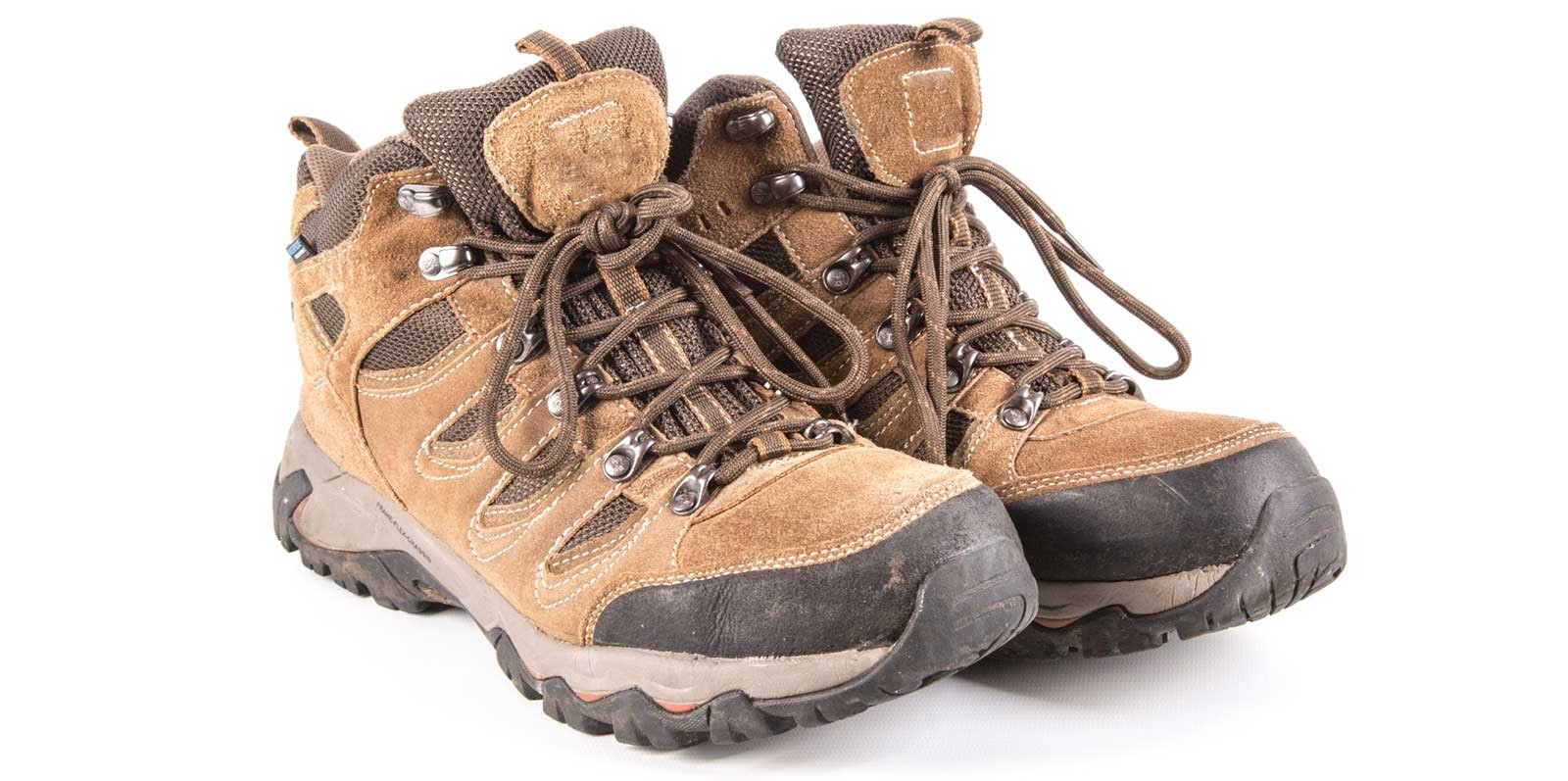 Durable waterproof trekking boots with sturdy soles designed for rocky Himalayan trails, providing excellent grip, ankle support, and all-day comfort.