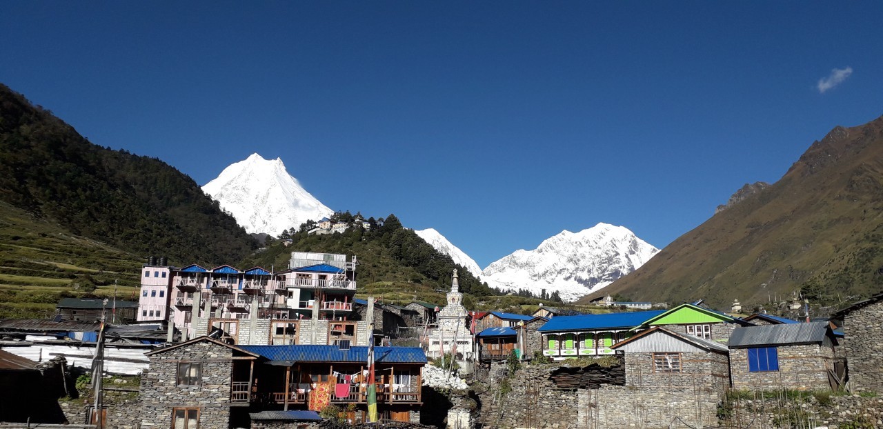 Mount Manaslu rising above the traditional village of Lho.