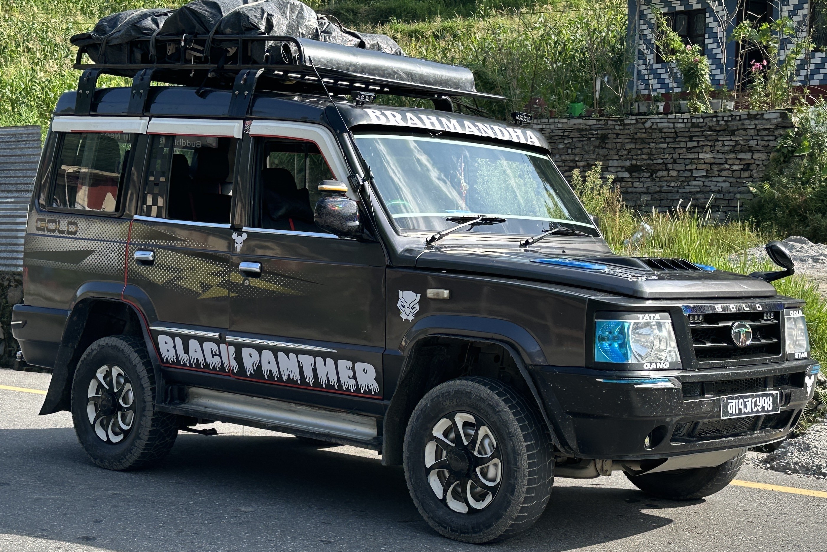 4WD jeep departing from Ghandruk village, winding mountain roads, terraced hillsides, traditional villages, and scenic Himalayan landscapes on the journey back to Pokhara.