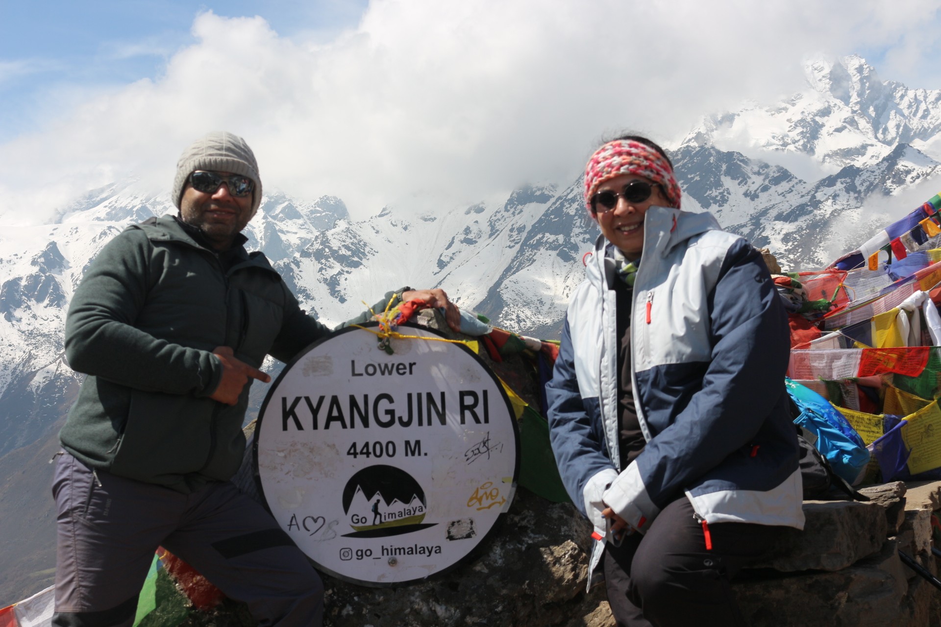 Trekkers ascending Kyanjin Ri and Tserko Ri in Langtang Valley carrying essential trekking gear and warm clothing for high-altitude hiking.