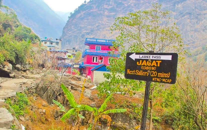 Scenic view of Jagat featuring traditional stone houses, terraced hillsides, and the Budhi Gandaki River valley along the Manaslu Circuit Trek.