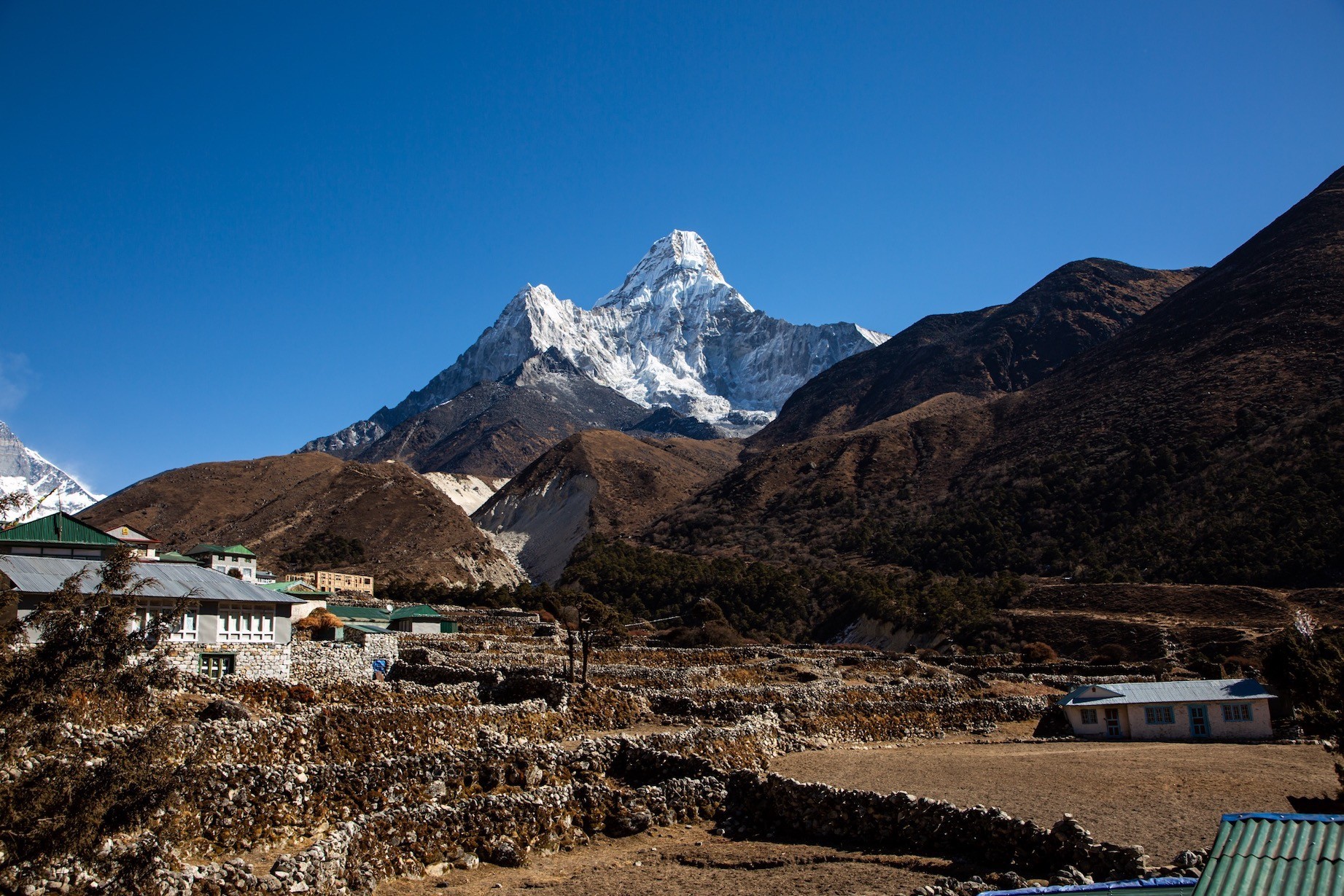 "Pangboche Village with traditional Sherpa homes, ancient monastery, and spectacular close-up views of Mount Ama Dablam on the Everest Base Camp Trek in Nepal"