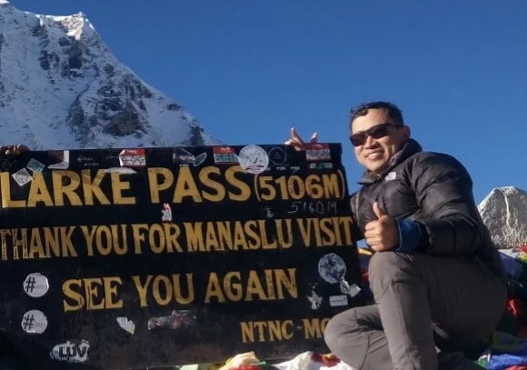 Larke Pass with prayer flags and snow-covered Himalayan peaks-Top of the journey