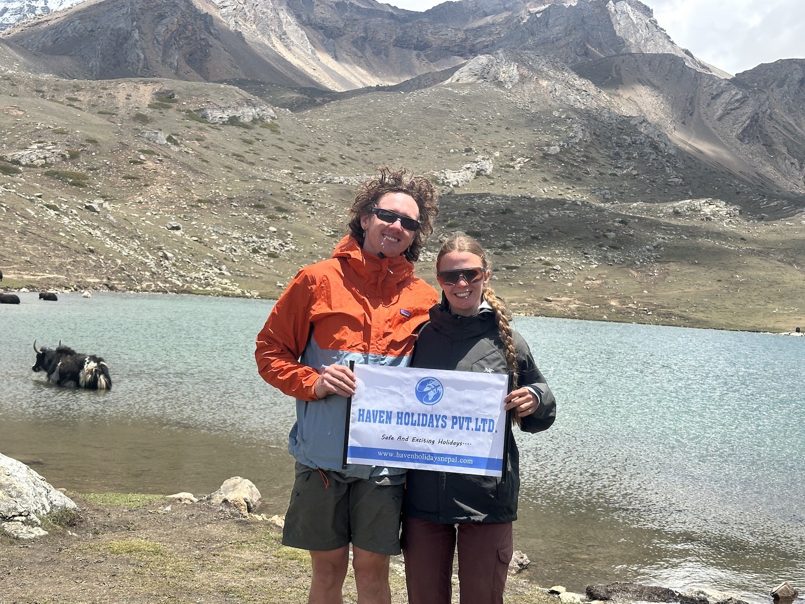 Crystal-clear Ice Lake above Manang on the Annapurna Circuit Trek, surrounded by snow-capped Himalayan peaks in Nepal.