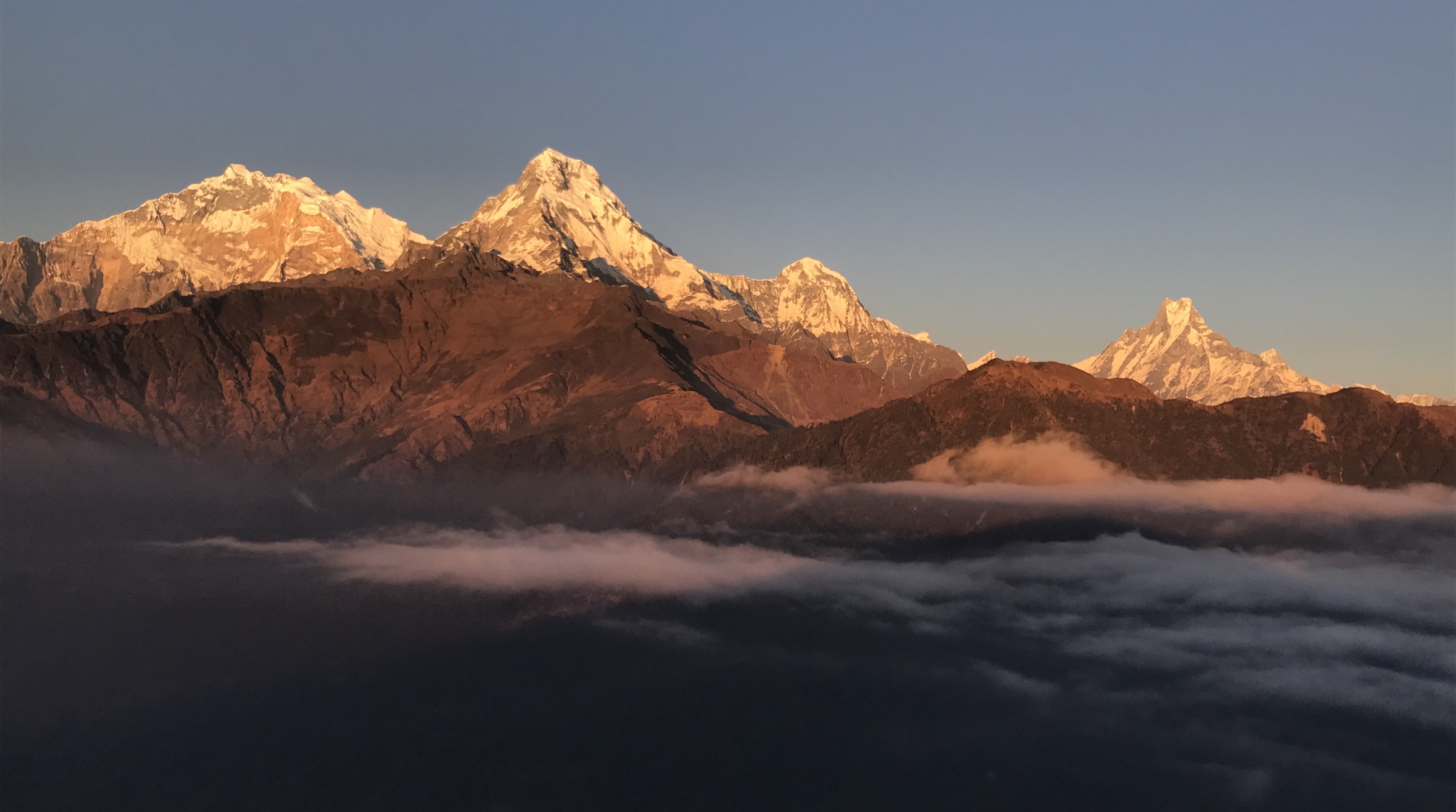 Sunrise view from Poon Hill with the Annapurna  mountain ranges glowing over the Nepal Himalayas.