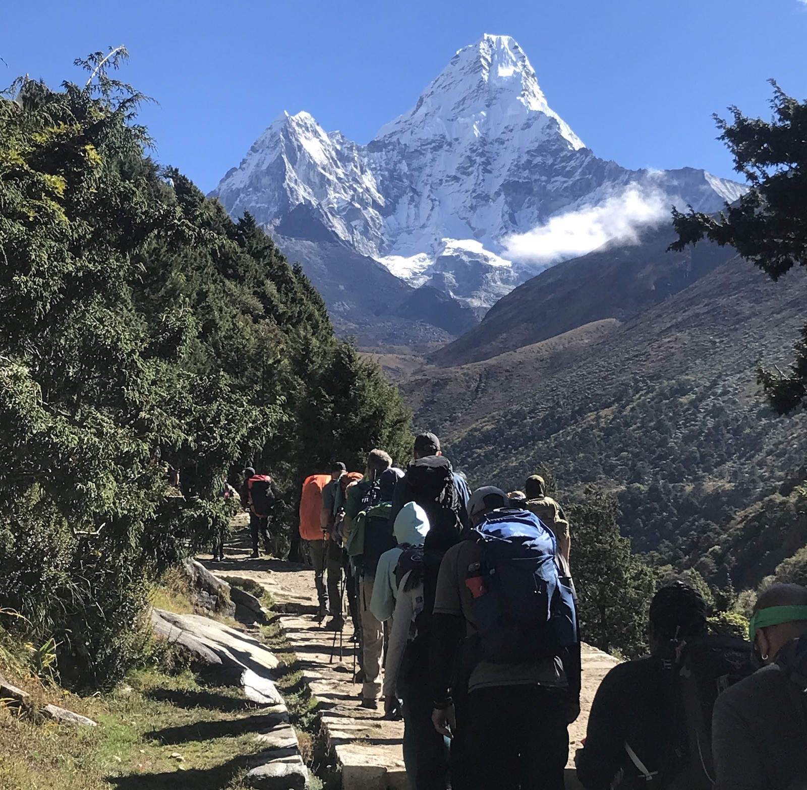 Crowded trekking trails on the Everest Base Camp route during peak season with groups of trekkers,Himalayan mountain scenery in Nepal.