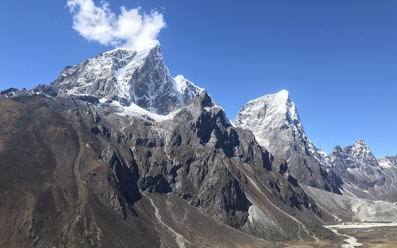 Taboche and Cholatse towering above the rugged alpine landscape with glacial valleys on the Everest Base Camp Trek.