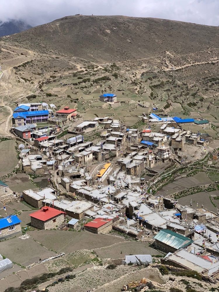 Nepal village life with farmland, terraced fields and traditional Himalayan houses in rural mountain region