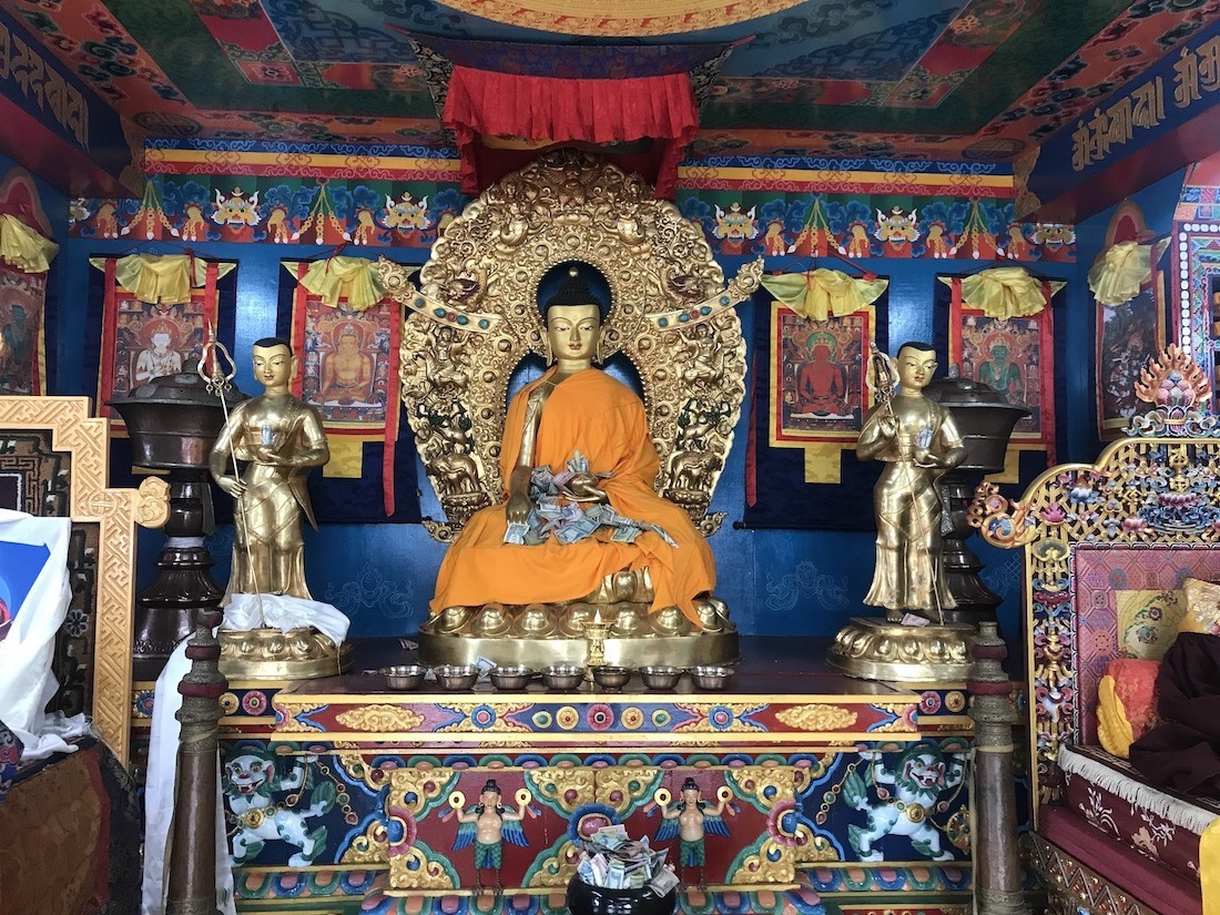 "Golden Buddha statue inside a Sherpa Buddhist monastery along the Everest Base Camp Trek, showcasing sacred Himalayan Buddhist art and spiritual heritage."  