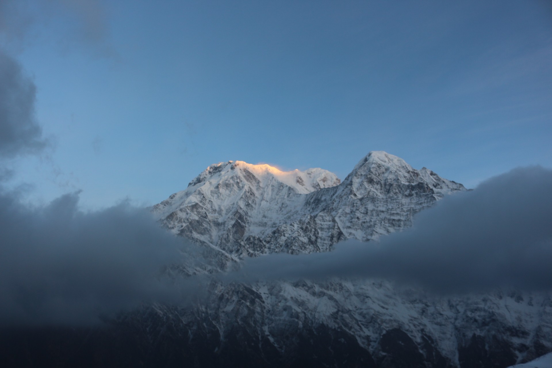Trekking trail from Low Camp to Badal Danda emerging above a sea of clouds with panoramic Himalayan mountain views in the Annapurna region of Nepal.