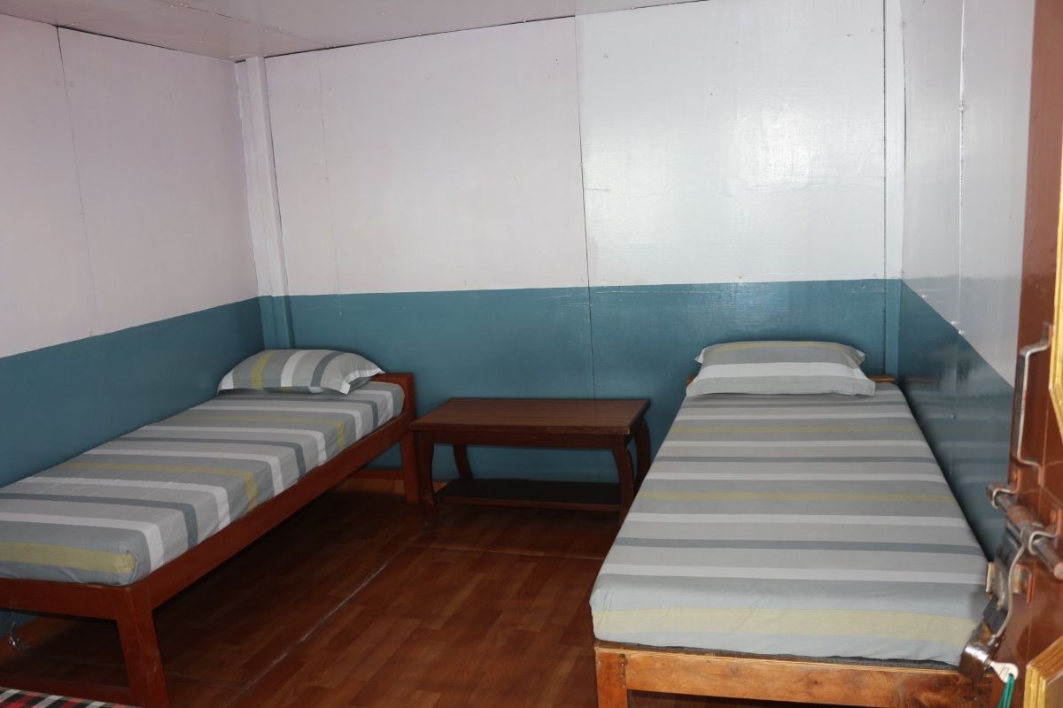 Cozy mountain teahouse room with Himalayan views on the Mardi Himal Trek in Nepal.