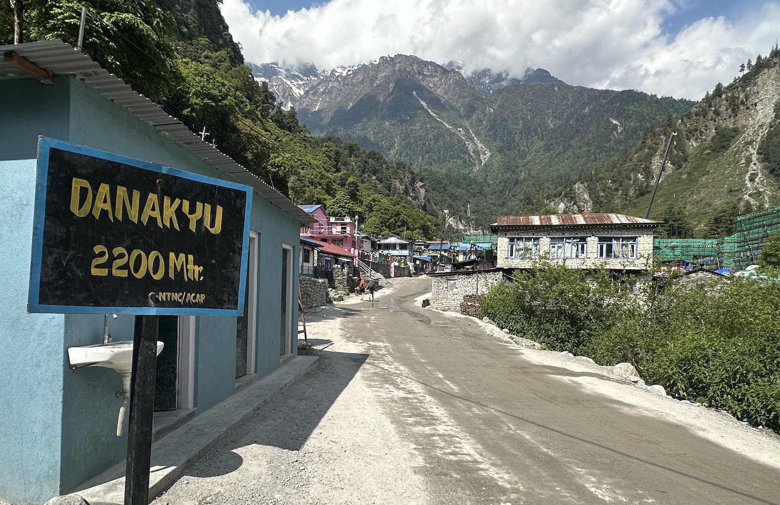 Scenic Himalayan village -Danakyu&nbsp;on the Annapurna Circuit Trek, featuring traditional stone houses, monastery architecture, and dramatic mountain landscapes in the background.