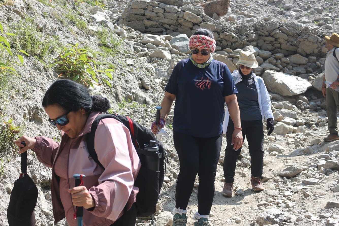 beginners balancing their walk on Langtang Valley Trail at Pahire, the most landslide risk zone