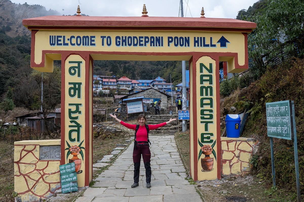 Entrance gate of Ghorepani along the Poon Hill Trek route, welcoming trekkers to the village surrounded by rhododendron forests and Himalayan mountain scenery.