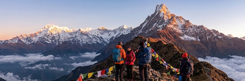 Trekkers reaching a Mardi Himal viewpoint early in the morning to watch the sunrise over the snow-capped Himalayan peaks.