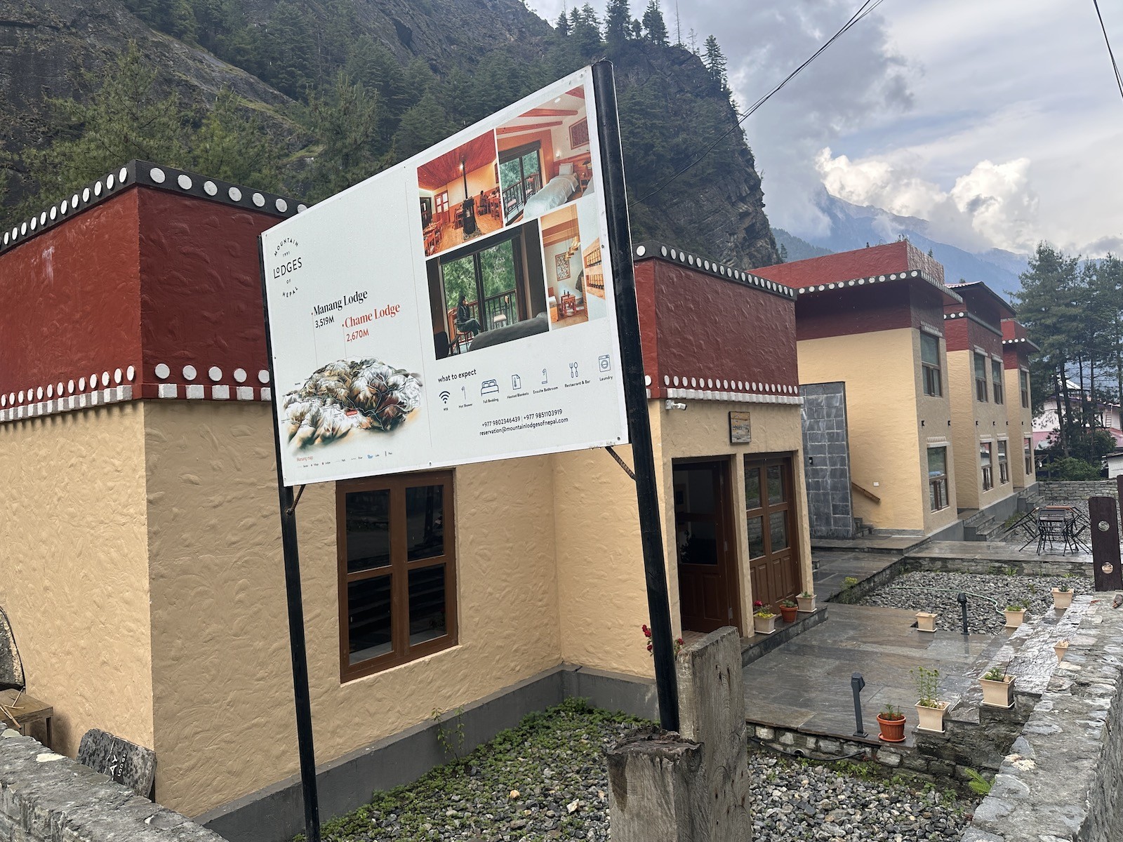 Luxury lodge in Chame on the Annapurna Circuit Trek featuring modern rooms, elegant wooden interiors, comfortable beds, a cozy dining hall, and panoramic views of Lamjung Himal and the surrounding Himalayan mountains.