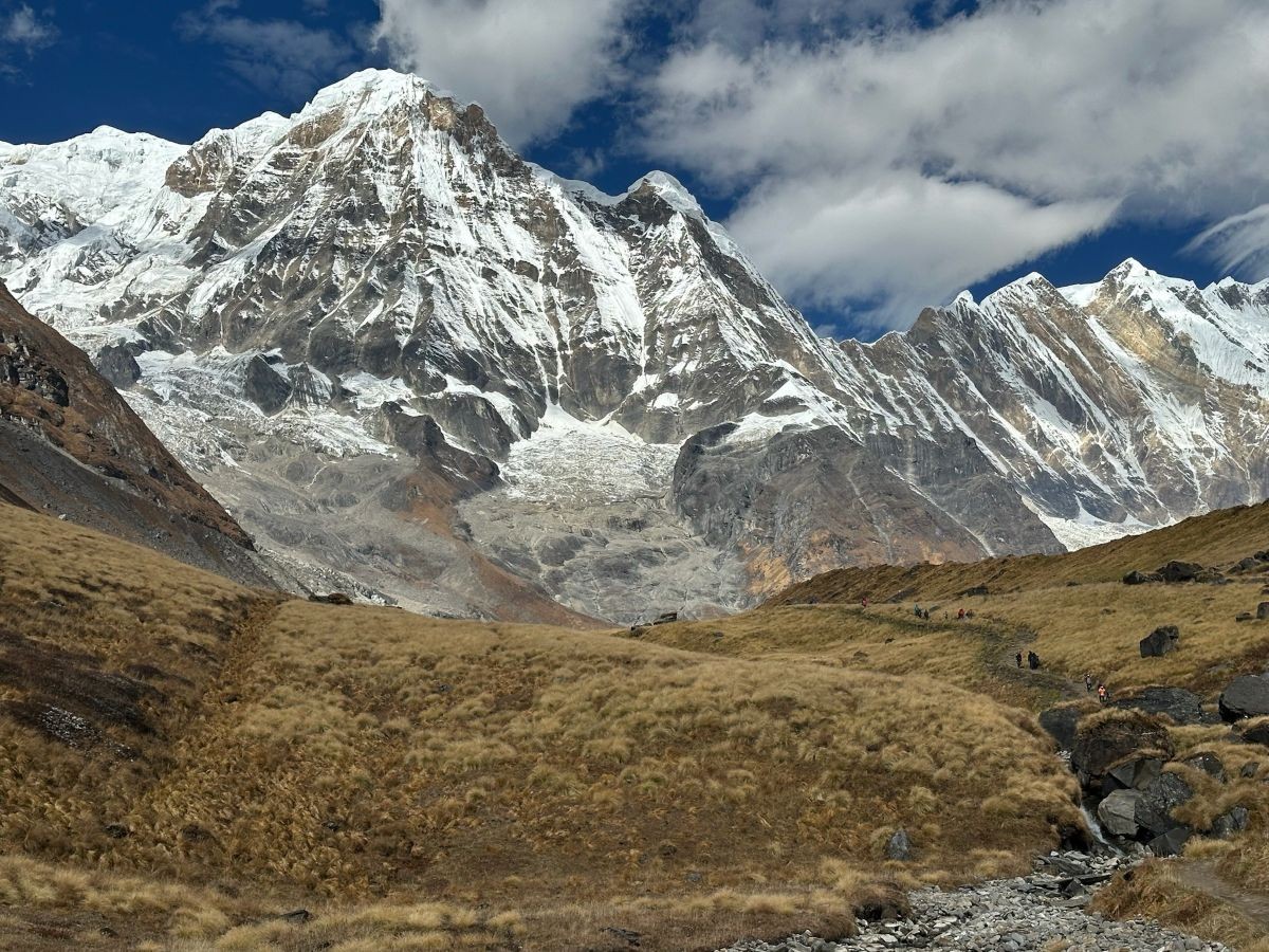 Stunning Annapurna Base Camp landscape with snow-covered Himalayan peaks, glaciers, and rocky alpine terrain in Nepal.