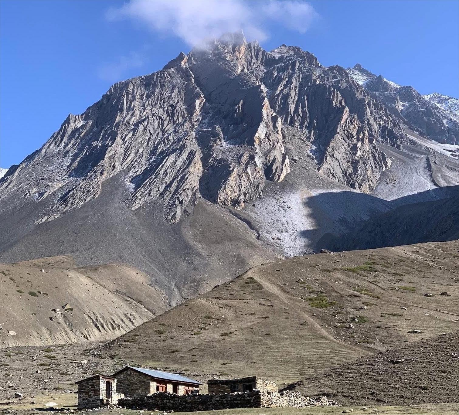 Nepal alpine landscape with high mountains, rocky terrain and Himalayan trekking scenery