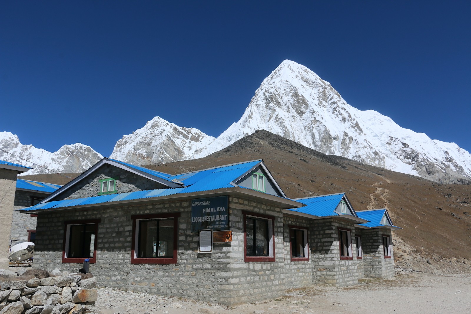 "Traditional teahouse on the Everest Base Camp Trek with a warm dining room and cozy twin bedrooms during November in the Khumbu region" 