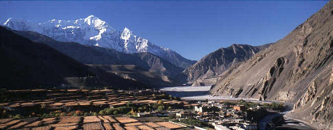 Kali Gandaki Valley at Kagbeni in Nepal with desert-like Himalayan landscape and traditional village on Annapurna Circuit route”