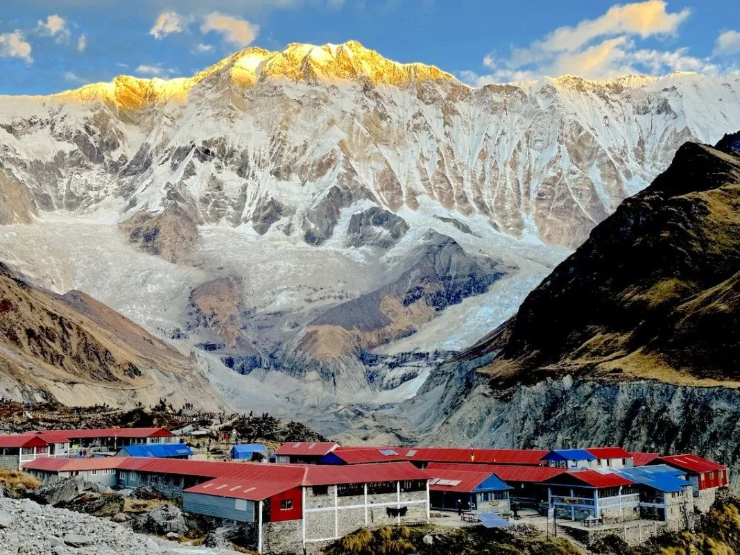 Annapurna Base Camp lodge with sunrise over the Annapurna mountains.
