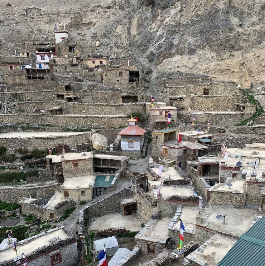Traditional stone-built village in the Nar Phu Valley of Nepal, surrounded by rugged Himalayan mountains, ancient monasteries, and high-altitude landscapes.