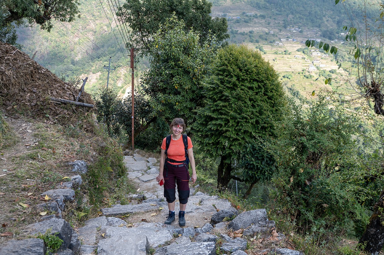 Trekkers climbing the famous stone staircases of Ulleri on the Ghorepani Poon Hill Trek in the Annapurna region of Nepal.