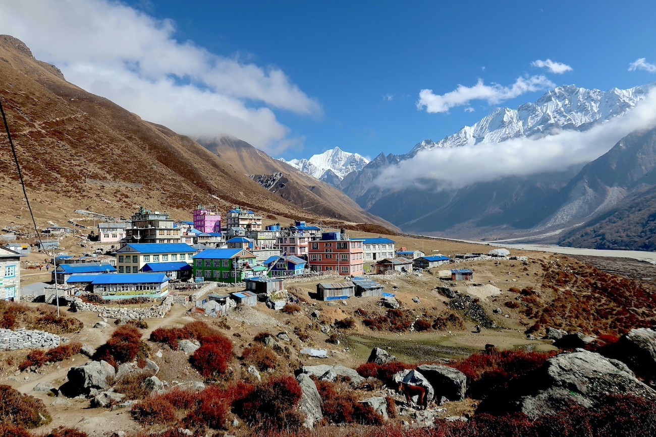 Kyanjin Gompa settlement surrounded by rugged Himalayan mountains in Langtang Valley, Nepal.