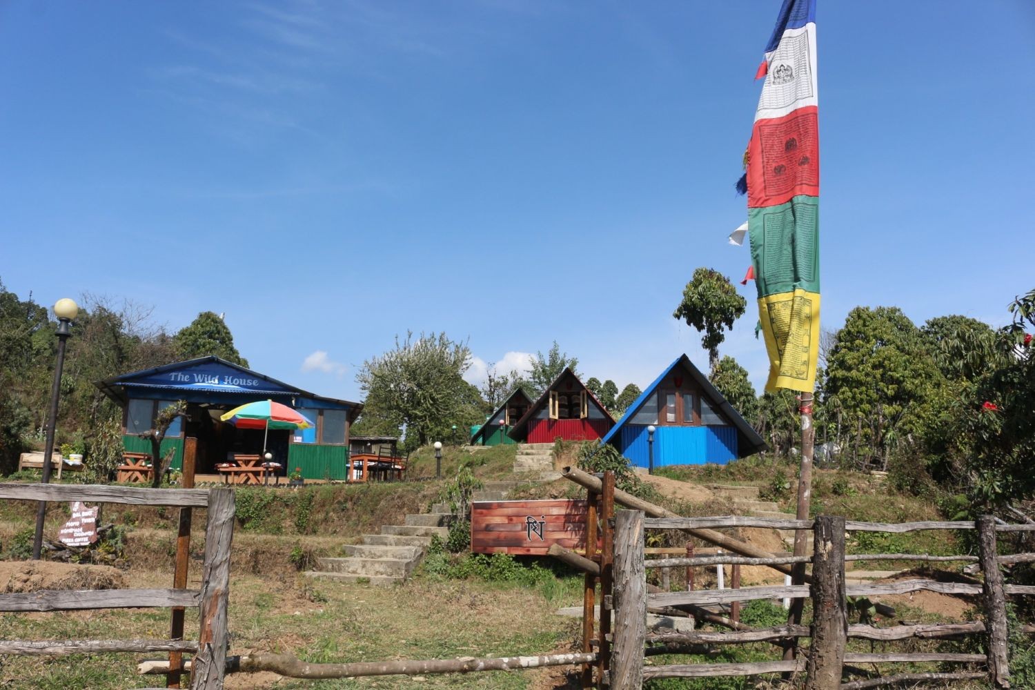 Basic trekking lodge in the Annapurna region of Nepal offering facilities such as simple rooms, shared bathrooms, warm meals, and a common dining area for trekkers on the Mardi Himal route.