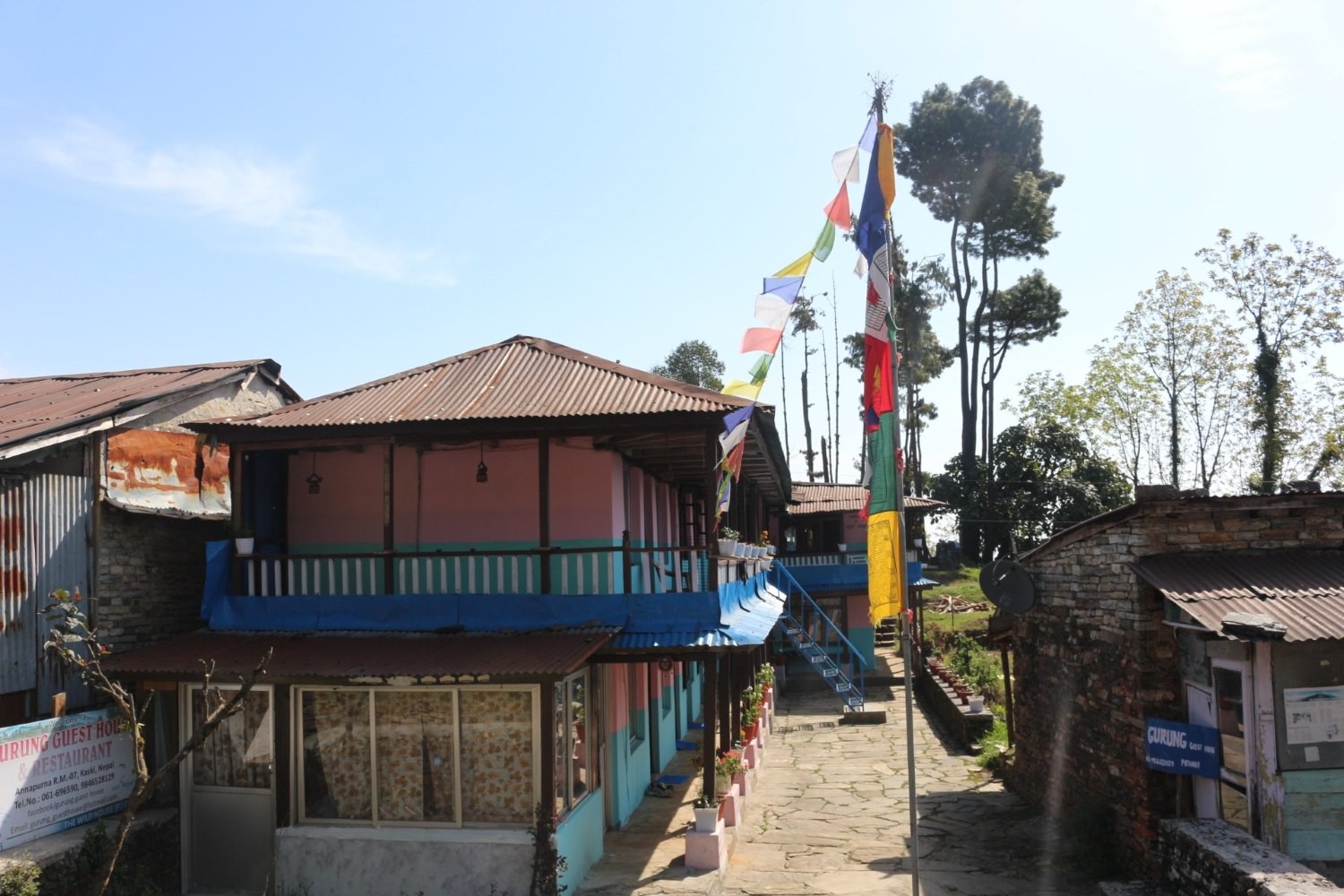 Lodge in Pothana village on the Mardi Himal Trek route in Nepal, a small teahouse-style accommodation surrounded by forested hills, offering rooms and meals for trekkers passing through the Annapurna region.