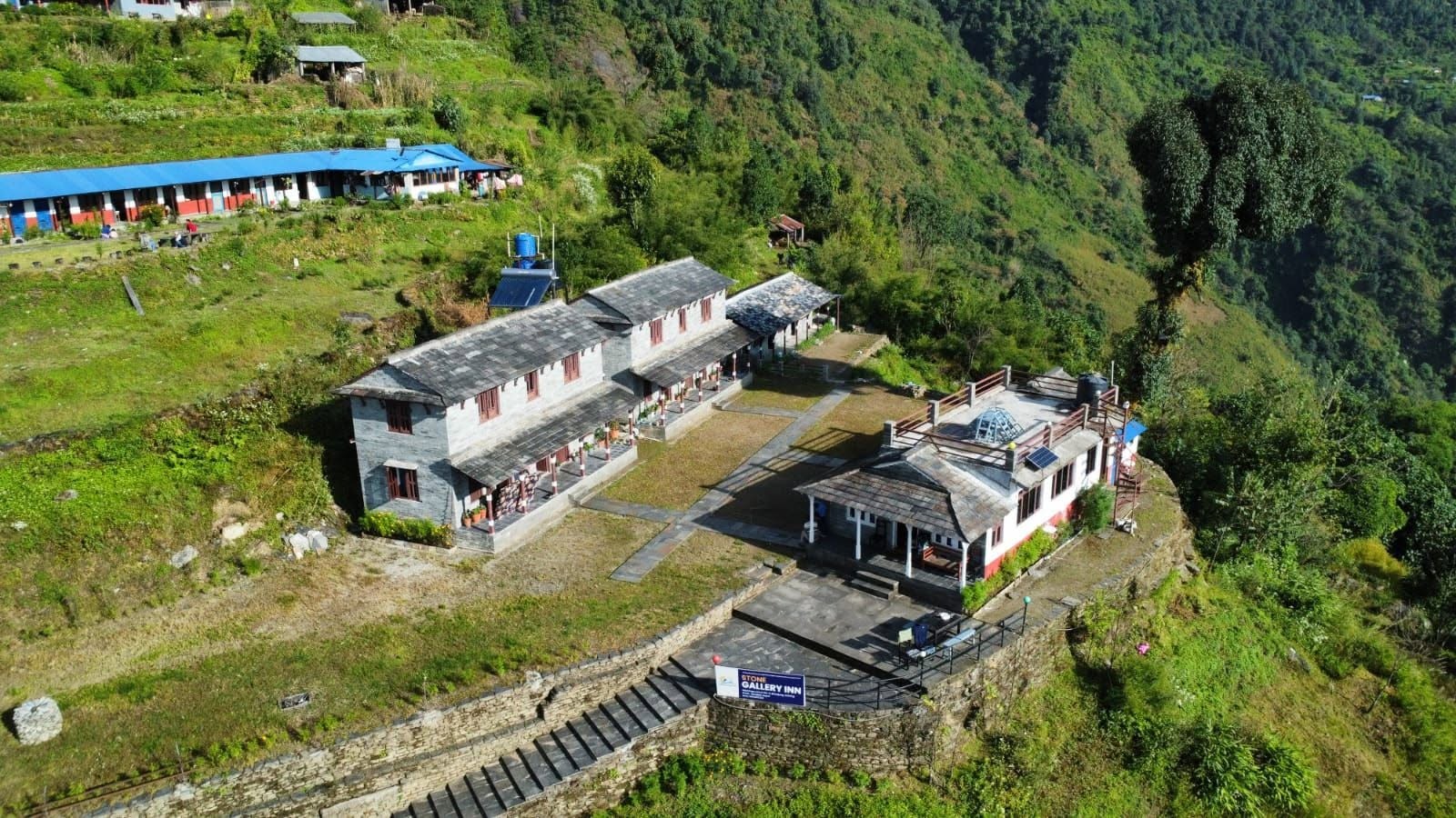 Traditional houses and terraced hillsides in Siding Village on the Mardi Himal Trek route in Nepal.