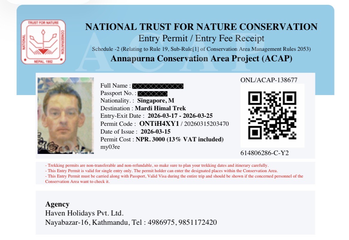 Trekkers presenting their Annapurna Conservation Area Permit (ACAP) at a permit checkpoint before entering the Mardi Himal Trek in the Annapurna region of Nepal. 
