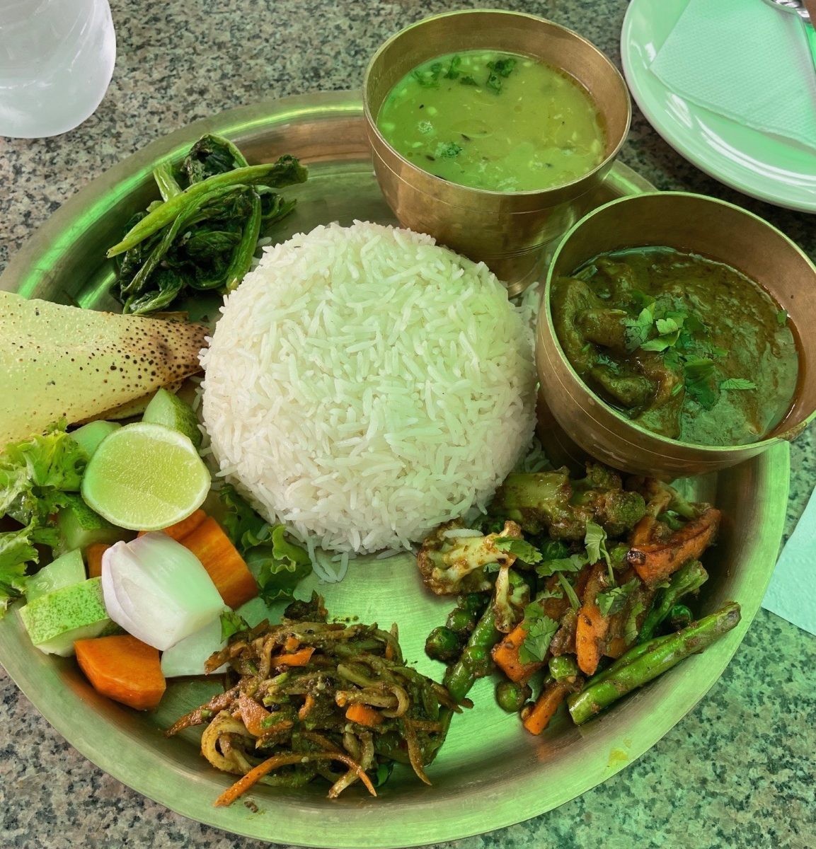 Traditional dal bhat set with rice, lentils, vegetables, and pickles