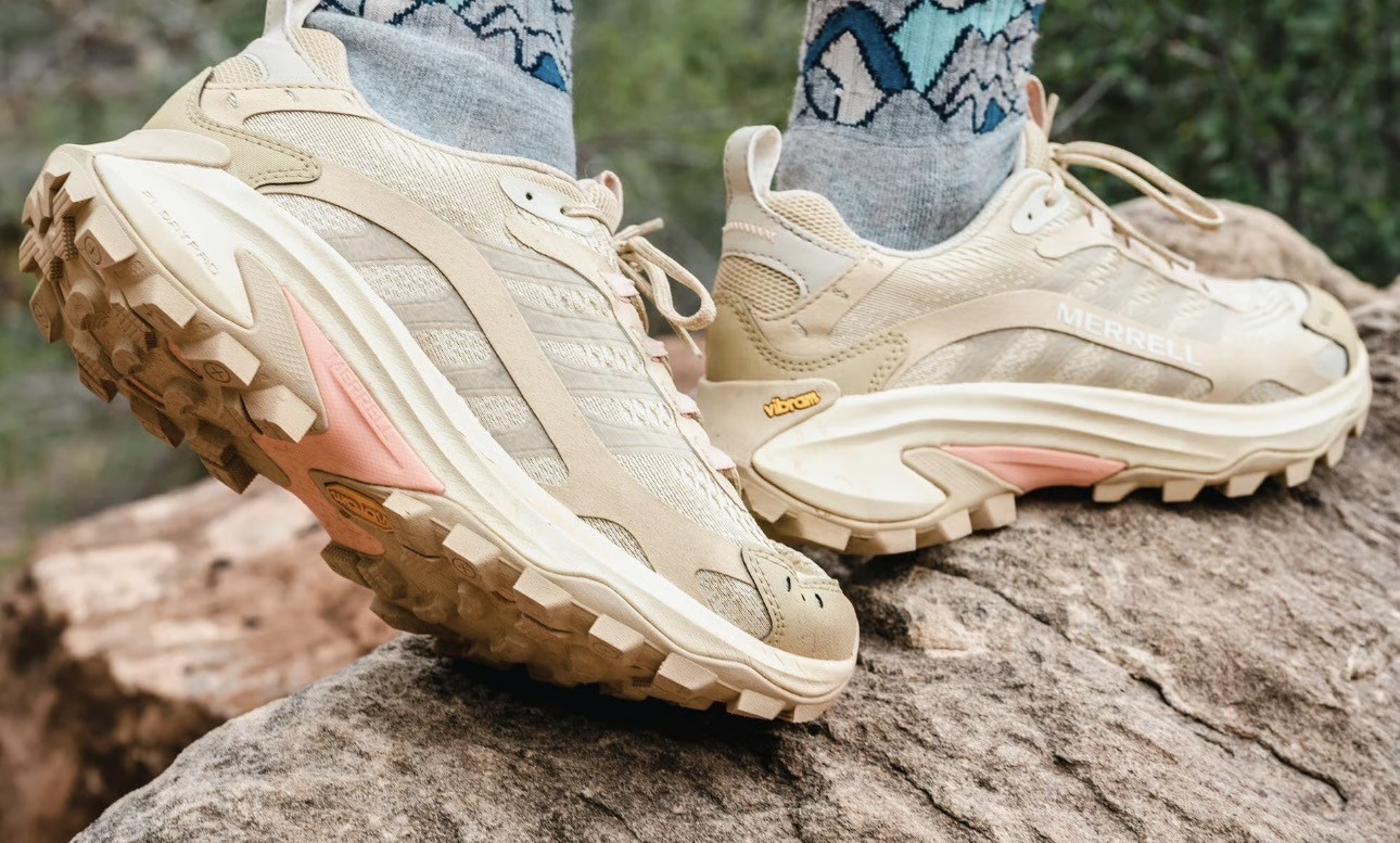 Trekking shoes on a rugged Himalayan trail in Nepal, providing comfort, grip, and stability for mountain trekking.