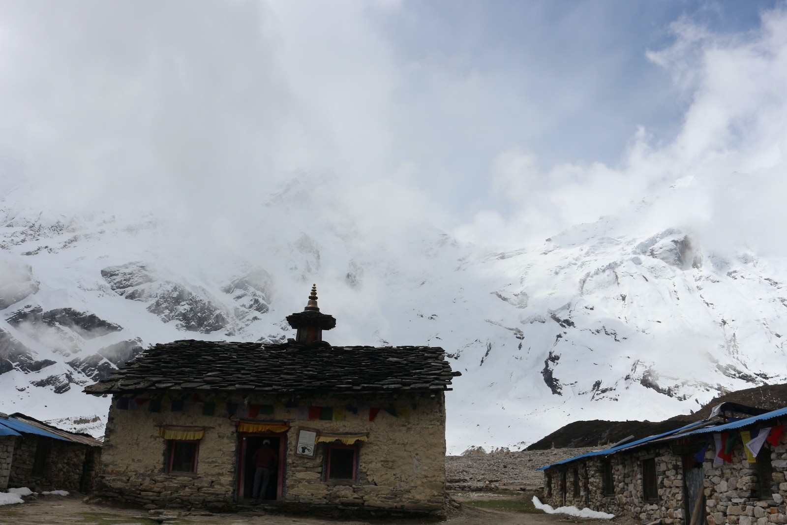 Pungyen Gompa surrounded by dramatic Himalayan mountains and the remote landscape of the Manaslu region.