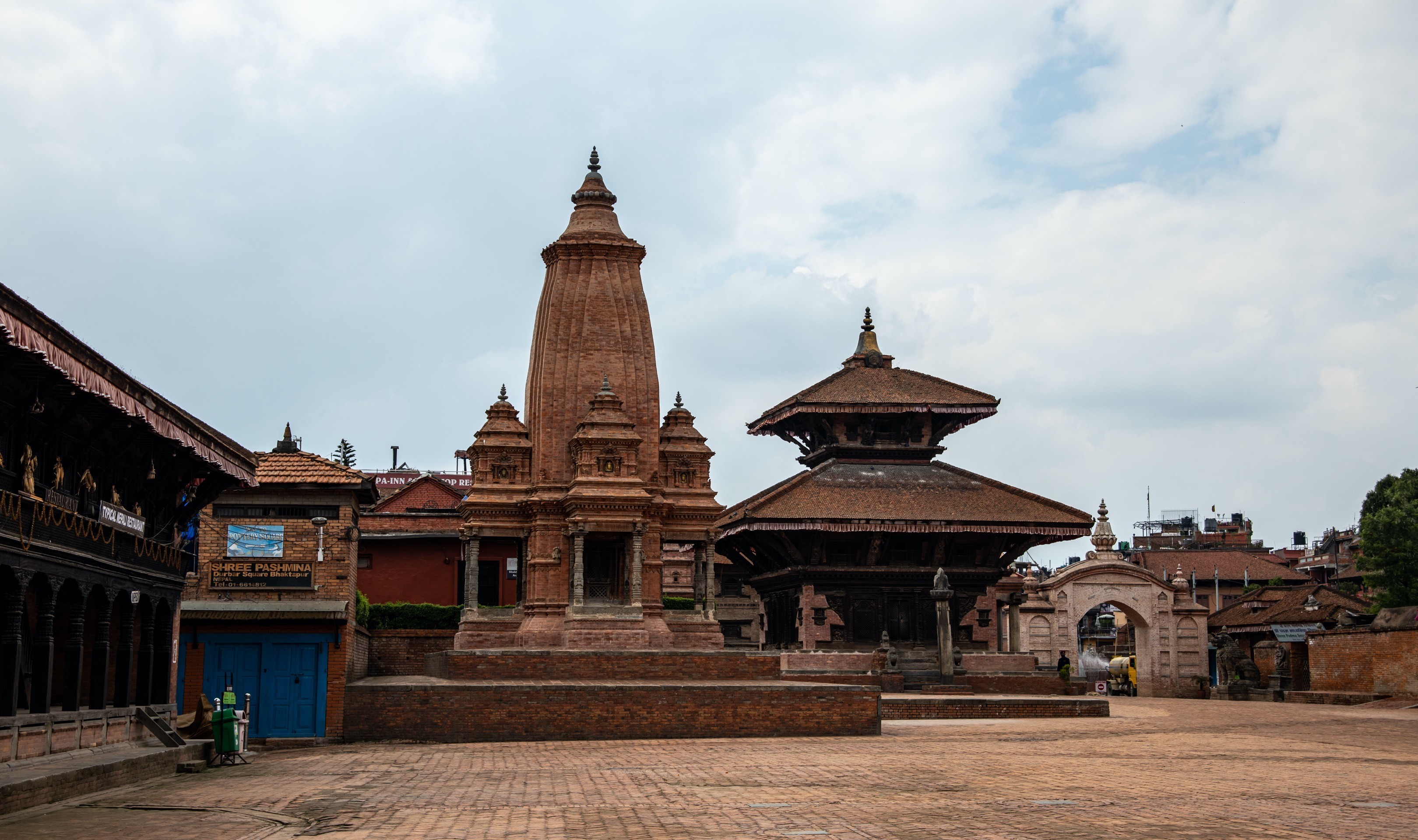 Historic Bhaktapur Durbar Square featuring ancient temples, palace courtyards, pagoda-style architecture, and intricate Newari carvings in Bhaktapur, Nepal.