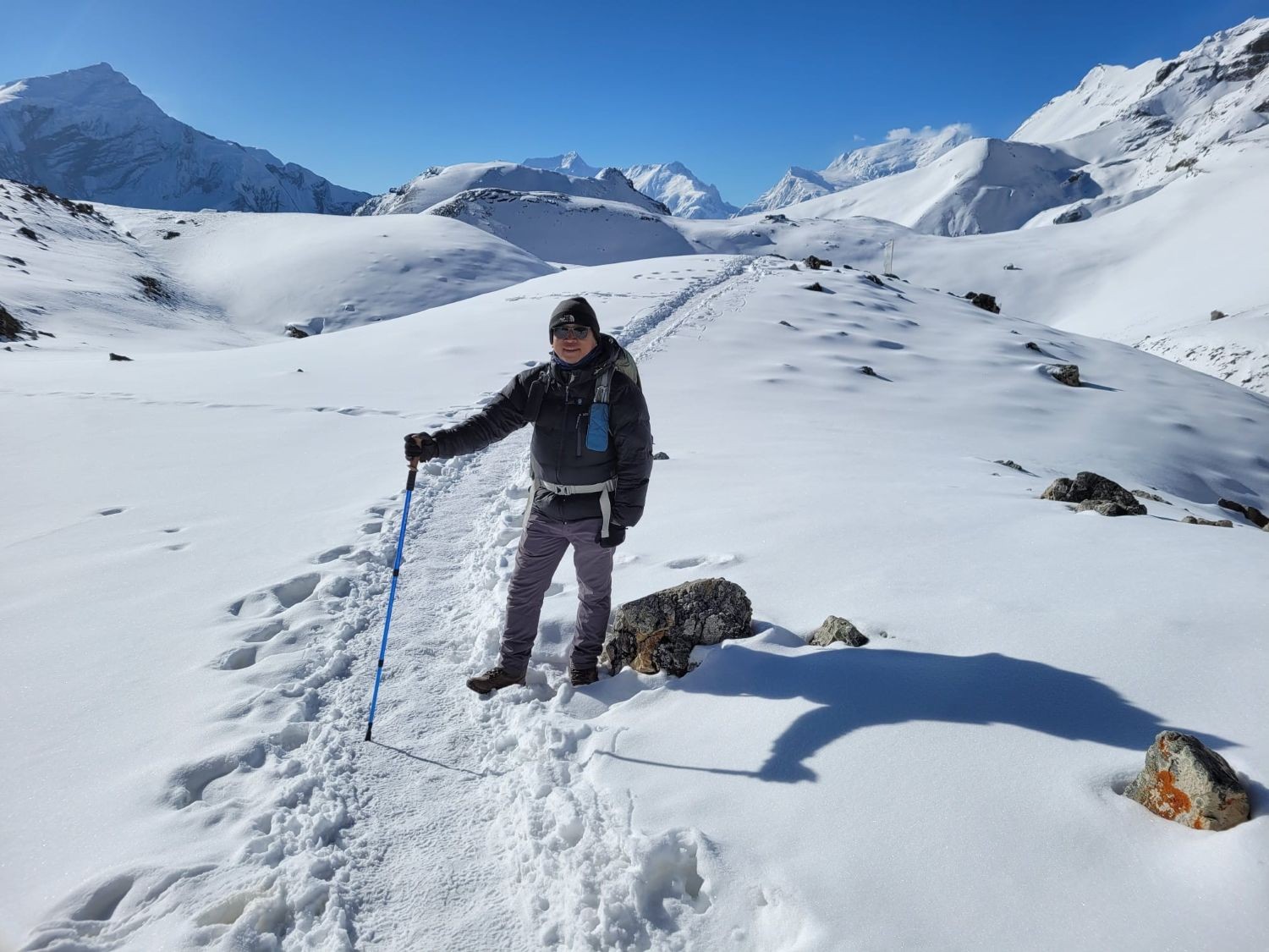 Snow-covered trail leading to Thorong Pass in the Himalayas