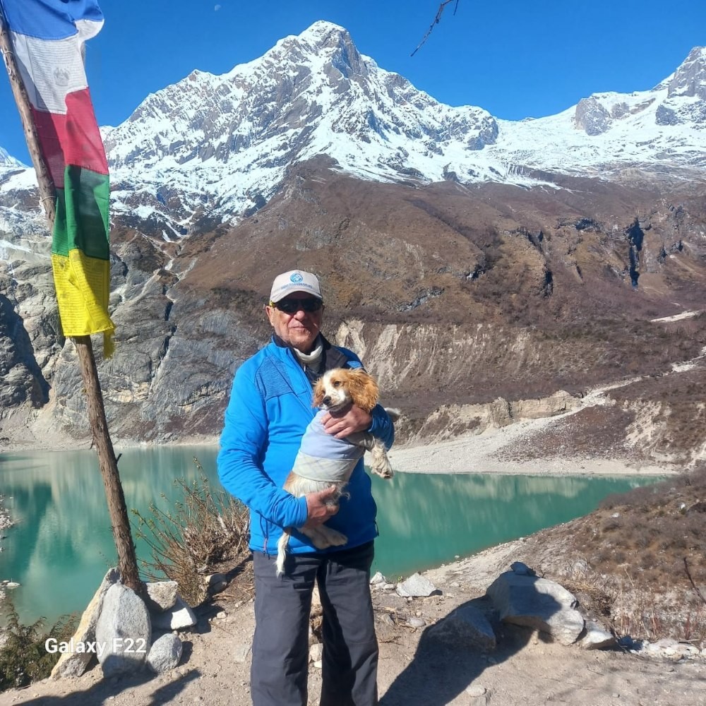 Haven Holidays Guest carrying a dog at Birendra Lake in Manaslu region 