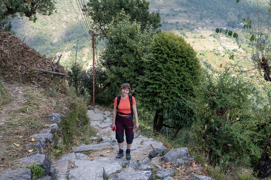 Trekkers enjoying a sunny October day on the Poon Hill Trek with clear blue skies, comfortable hiking conditions, and stunning Himalayan mountain views in Nepal.