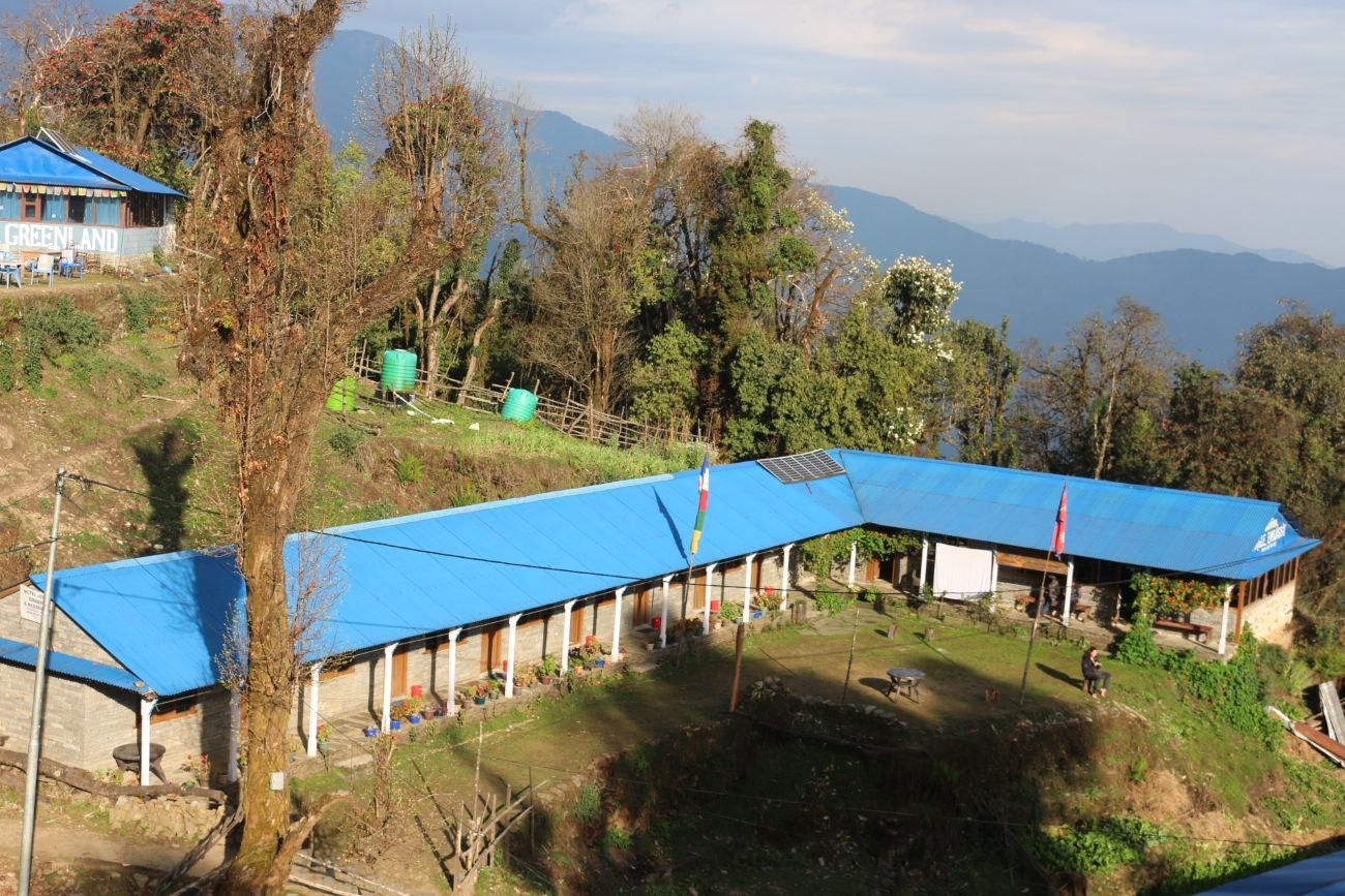 Traditional mountain lodges on the Mardi Himal Trek in Nepal, surrounded by forests, alpine landscapes, and stunning Himalayan mountain views.