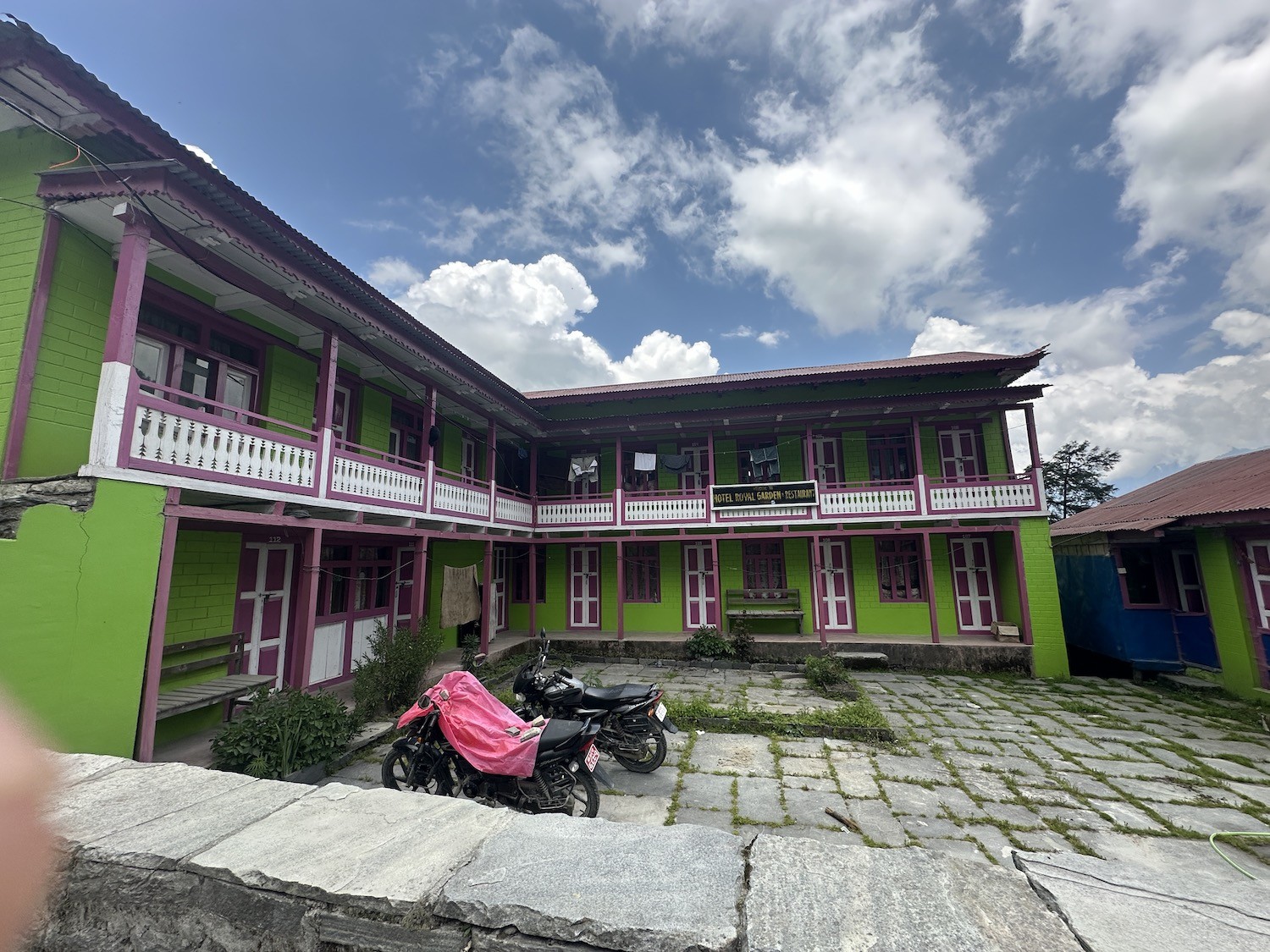Traditional teahouse in Timang Village on the Annapurna Circuit Trek with cozy twin rooms, a warm dining hall, stone-built lodges, and panoramic views of Manaslu and Lamjung Himal.
