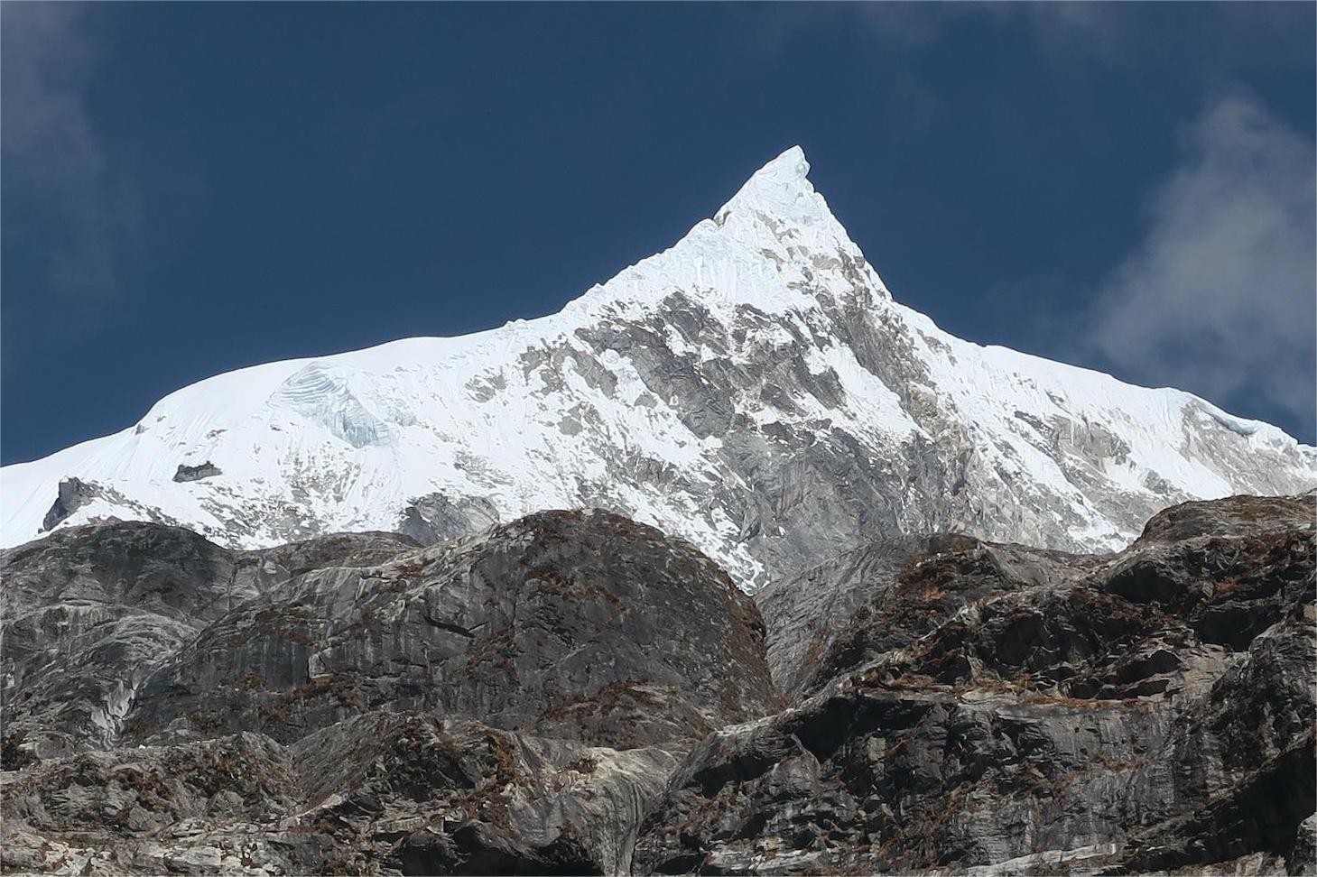 Langtang Himalayan mountains rising above the valley, featuring snow-capped peaks, glaciers, rugged alpine terrain, and breathtaking scenery in the Langtang region of Nepal.