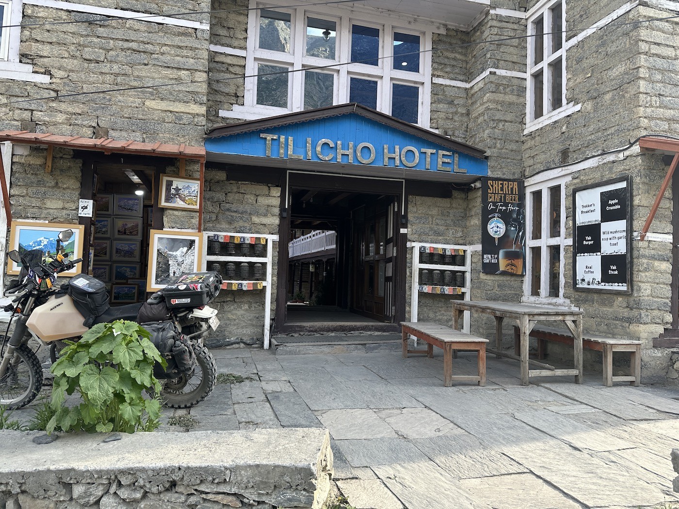 Traditional mountain lodges in Manang Village with stone-built architecture, cozy teahouses, snow-capped Himalayan peaks, and colorful prayer flags on the Annapurna Circuit Trek in Nepal.