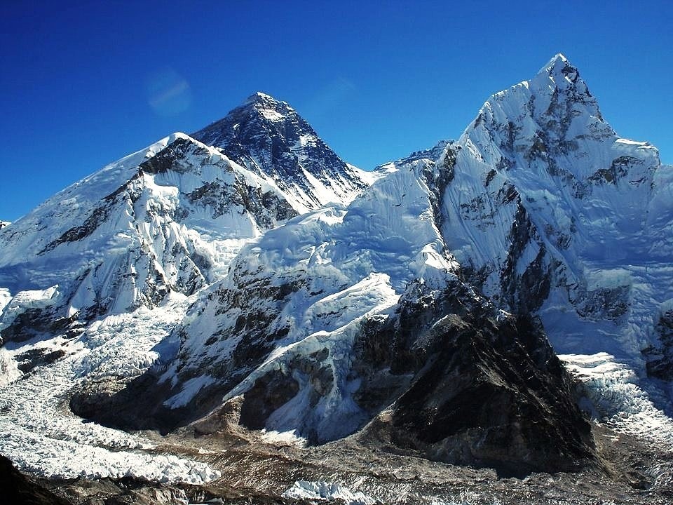 Everest Base Camp with tbreathtaking views of Mount Everest and Nuptse rising above the Khumbu Glacier under a clear Himalayan sky. 