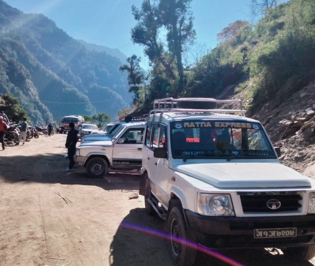 4WD jeep driving along a rugged mountain road on the route to Thamdanda, an overland alternative to Lukla flights for Everest trekkers.