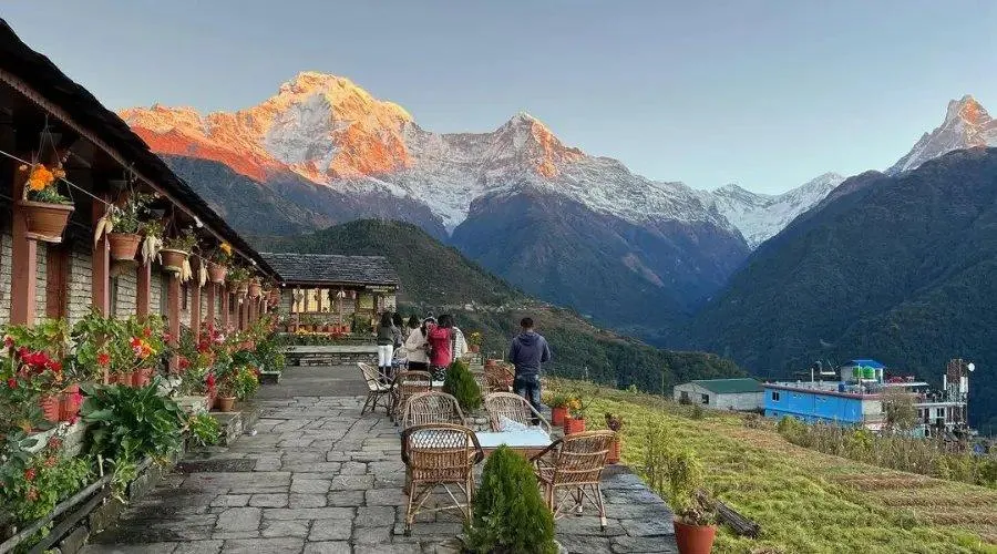 Traditional Gurung village surrounded by Himalayan mountains in Nepal.
