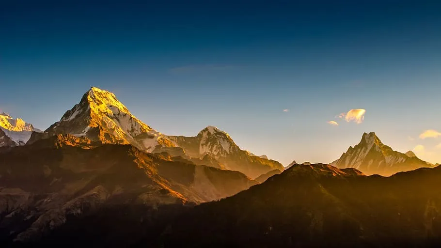 Golden sunrise over the Himalayan mountain range at Poon Hill.
